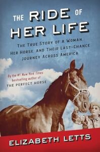 Book cover with light blue background with light clouds. Title of "The Ride of Her Life" with a horse and a female handler in the foreground.